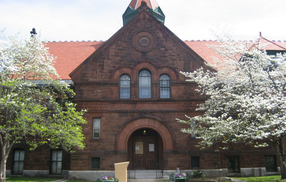 image: front of the library flanked by trees in bloom