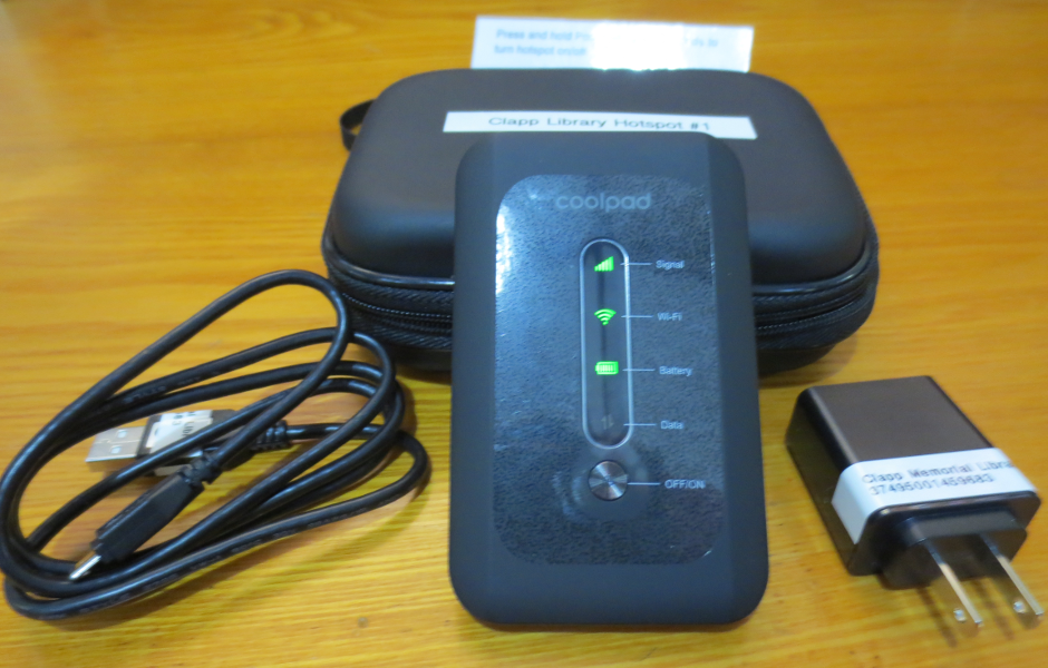 a mobile hotspot device, charger, and carrying case